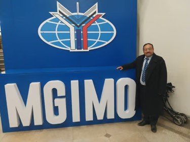 Prof. Sijariya standing beside the MGIMO University sign